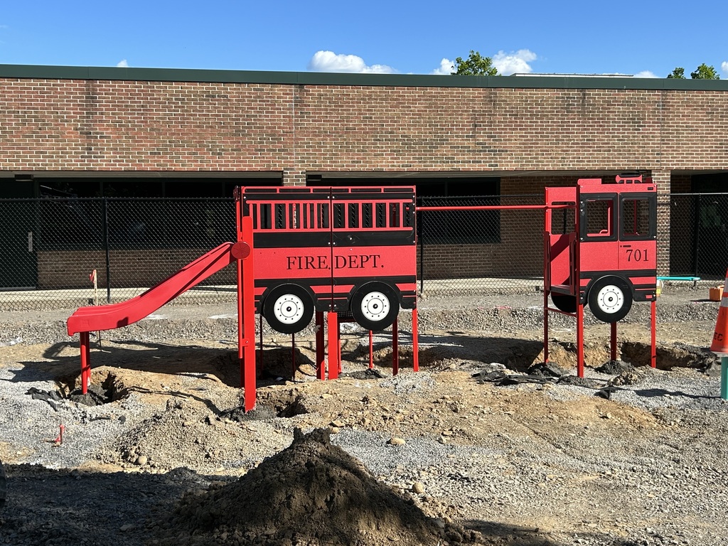 view of newly-installed playgroun equipment that looks like a fire truck