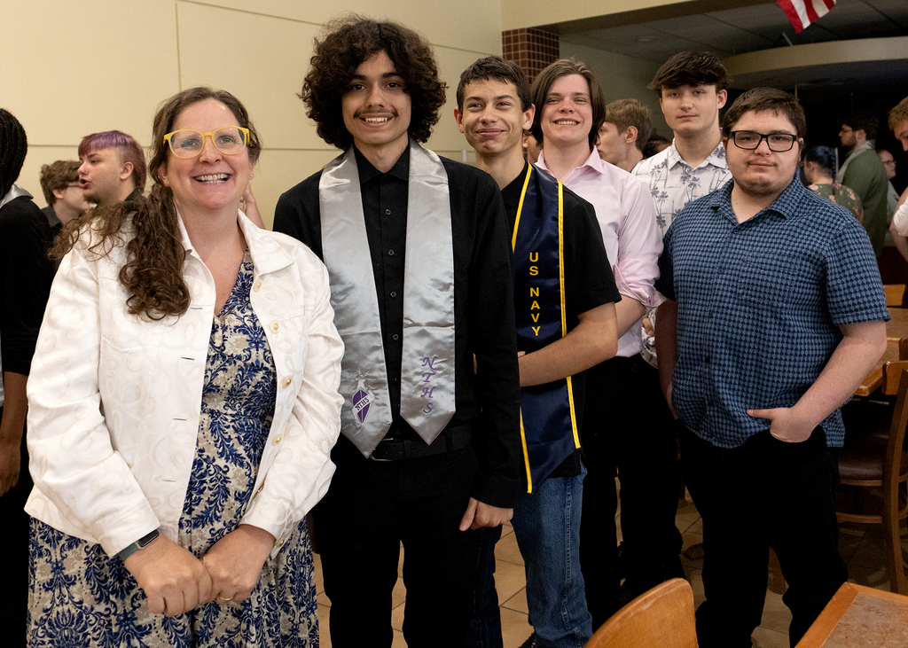 teacher poses with her students