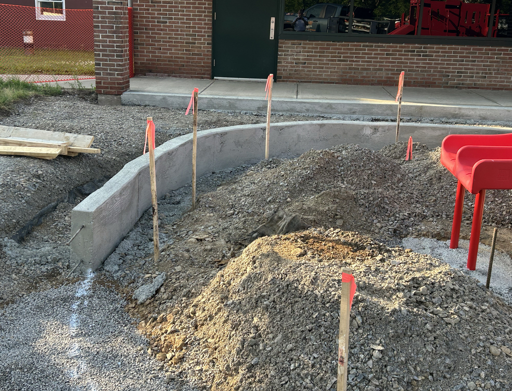 playground mulch containment curb poured in front of slide