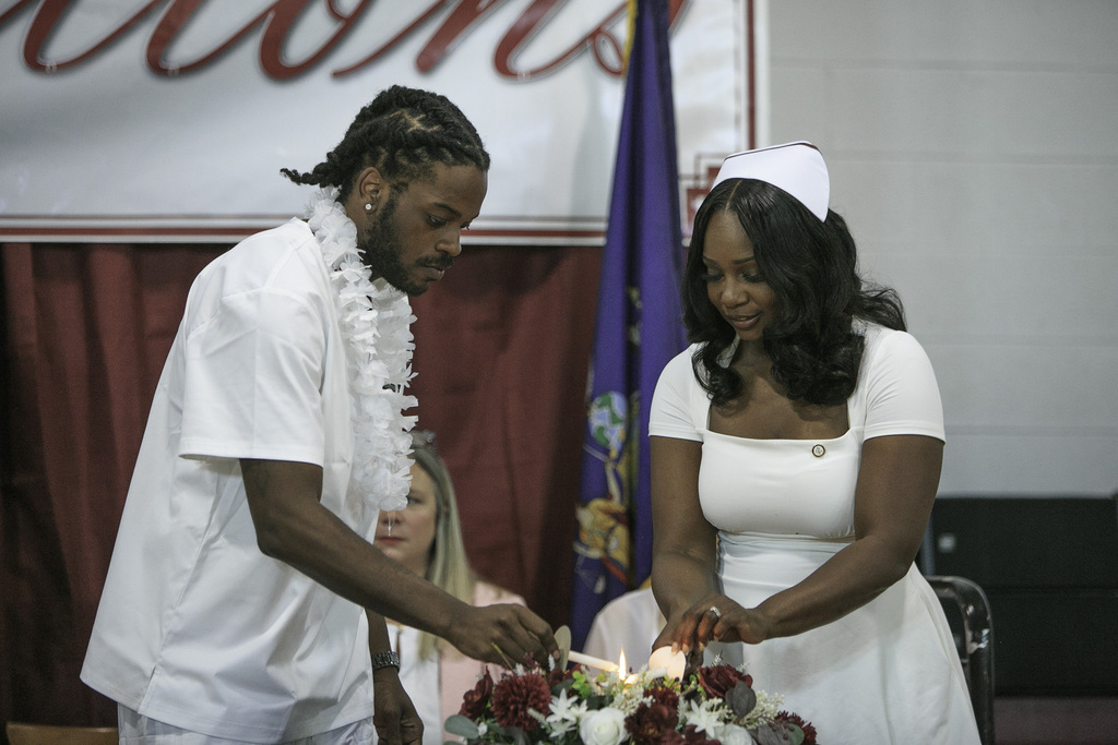 nursing students lighting candles