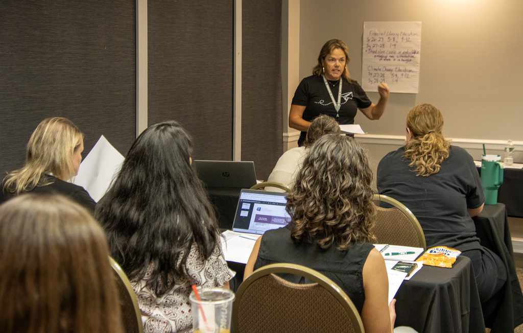 Betsy Hartnett presents to a room of participants