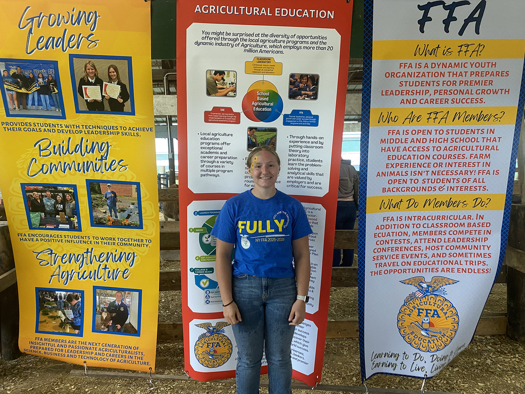 FFA student in front of DCMO BOCES FFA display