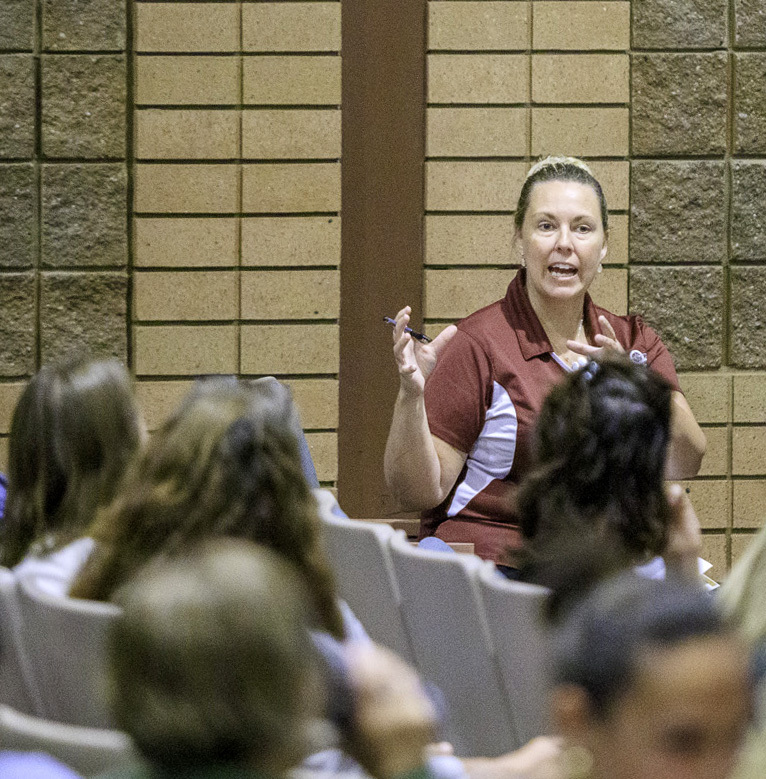 Amanda Hoover gestures as she answers a question