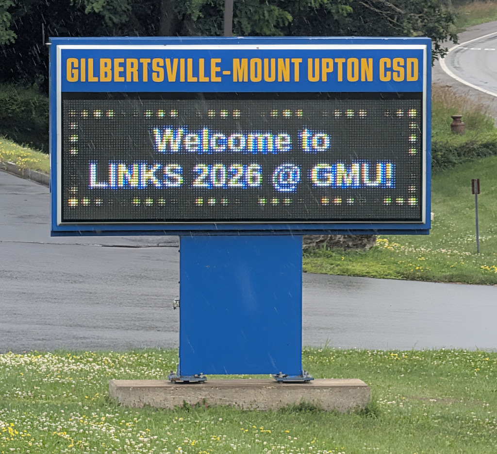 Sign that says Gilbertsville-Mount Upton CSD Welcome to LINKS 2026 # GMU!
