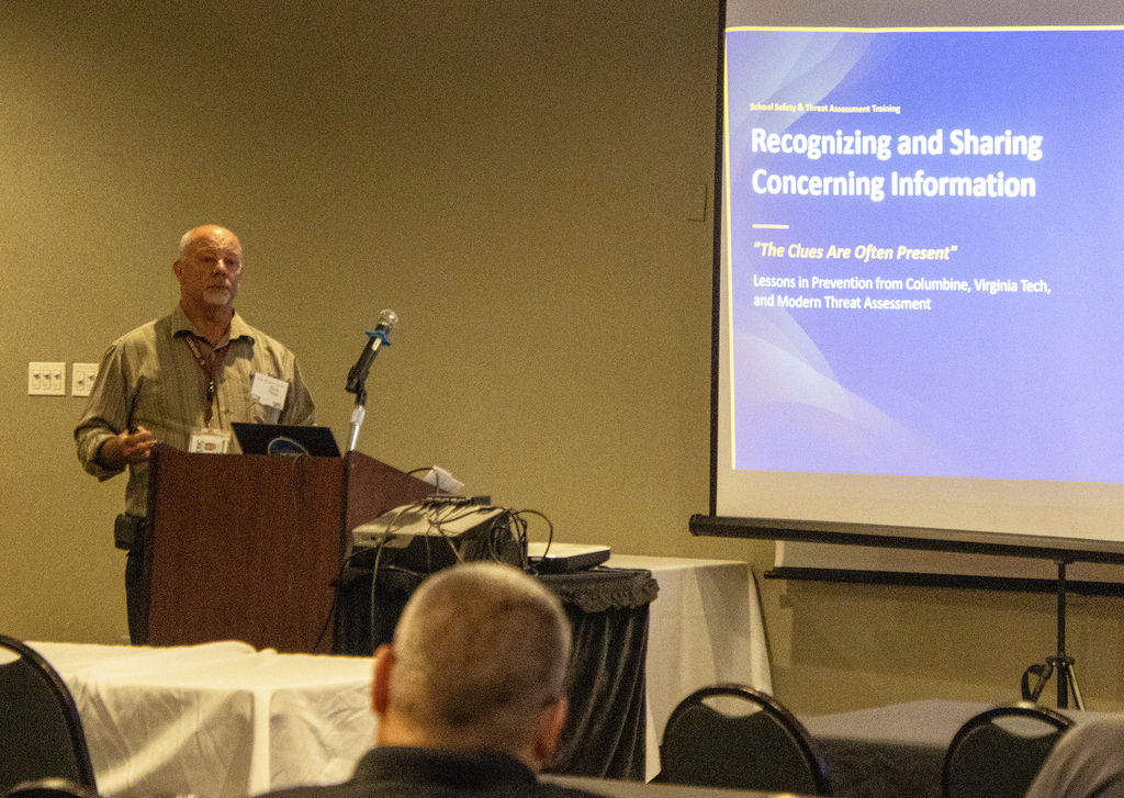 Rick Shaw speaking, screen says Recognizing and Sharing Concerning Information