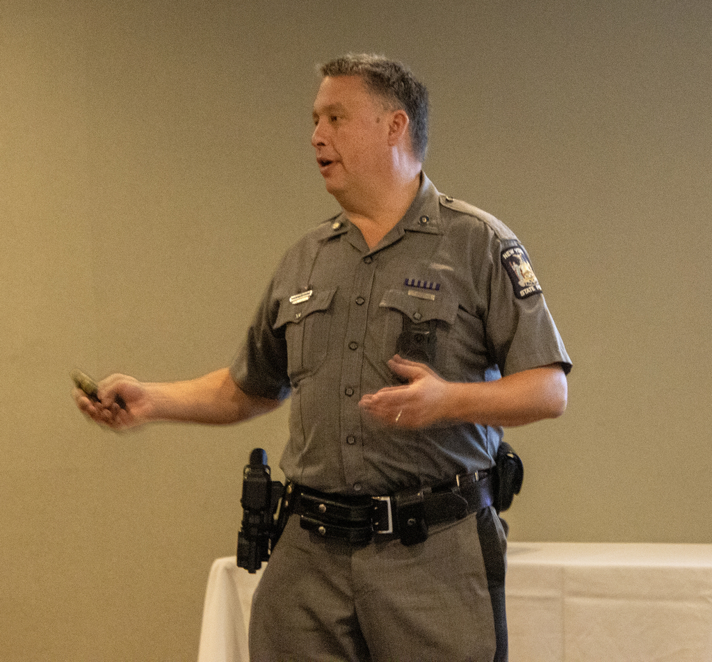 Trooper gesturing while speaking