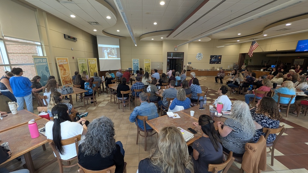 wide shot of staff filling cafeteria at Pole Campus