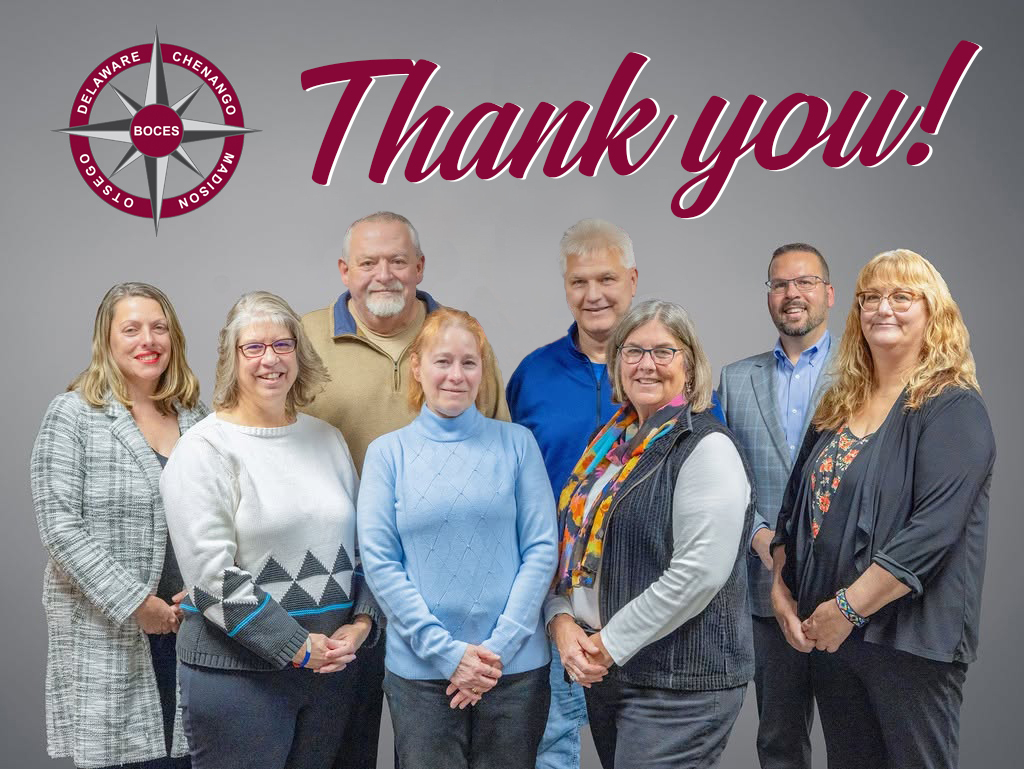 8 adults standing infront of DCMO BOCES compass logo - Thank you!