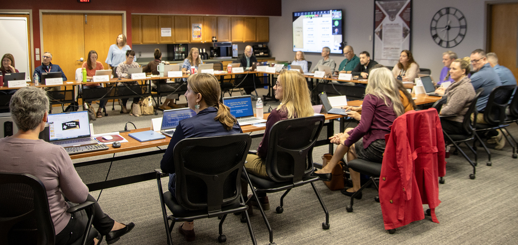 Group of school administrators around a conference table