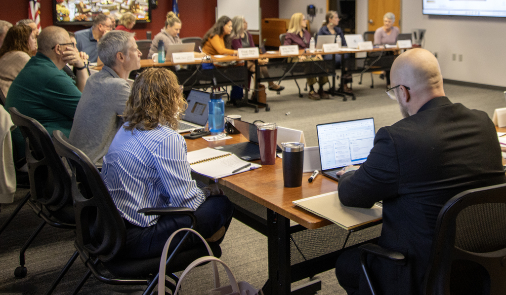 Group of school administrators around a conference table