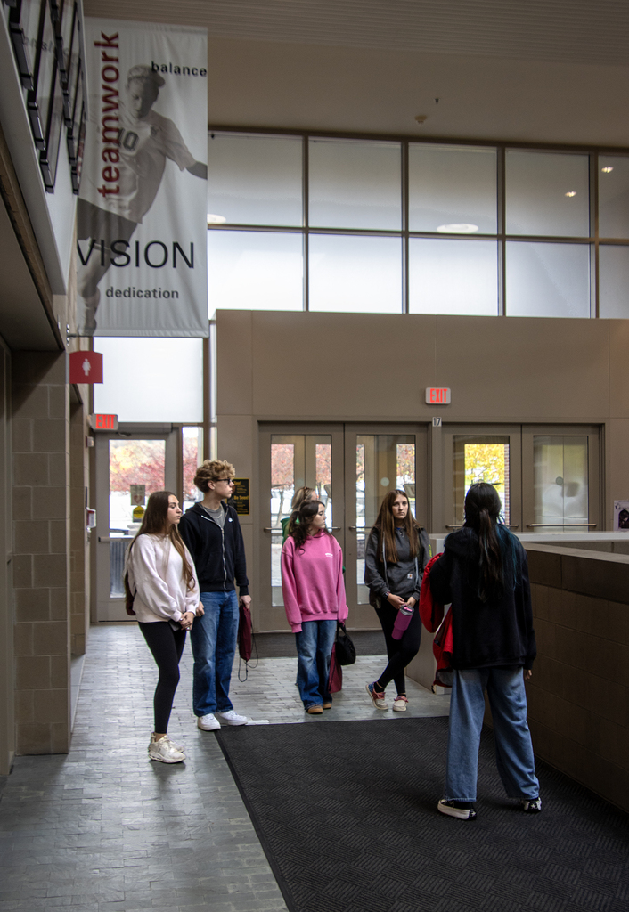 SUNY Oneonta tour guide speaking to students on a tour