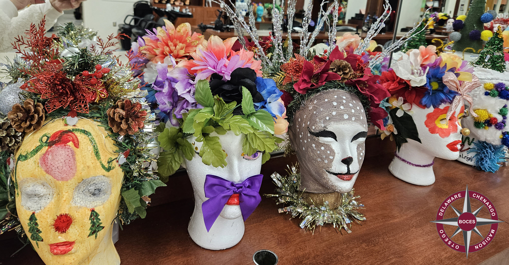 4 decorated styrofoam mannequins