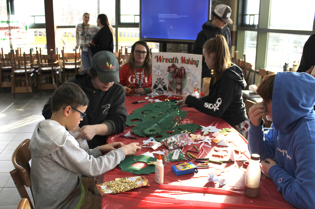 students working at the wreath-making table