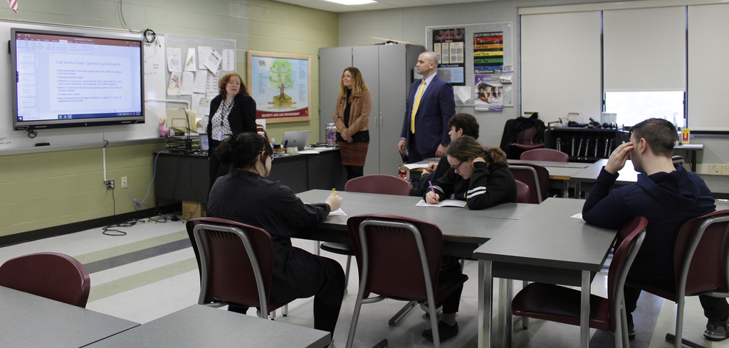 adults speaking to students