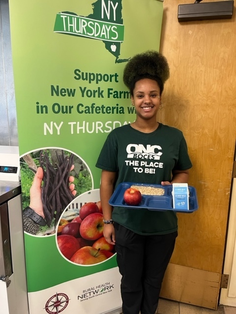 smiling girl with food tray