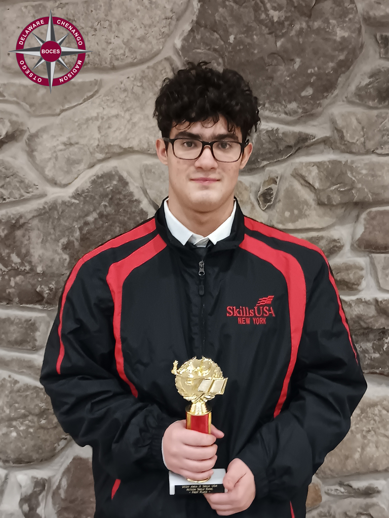 student holding trophy