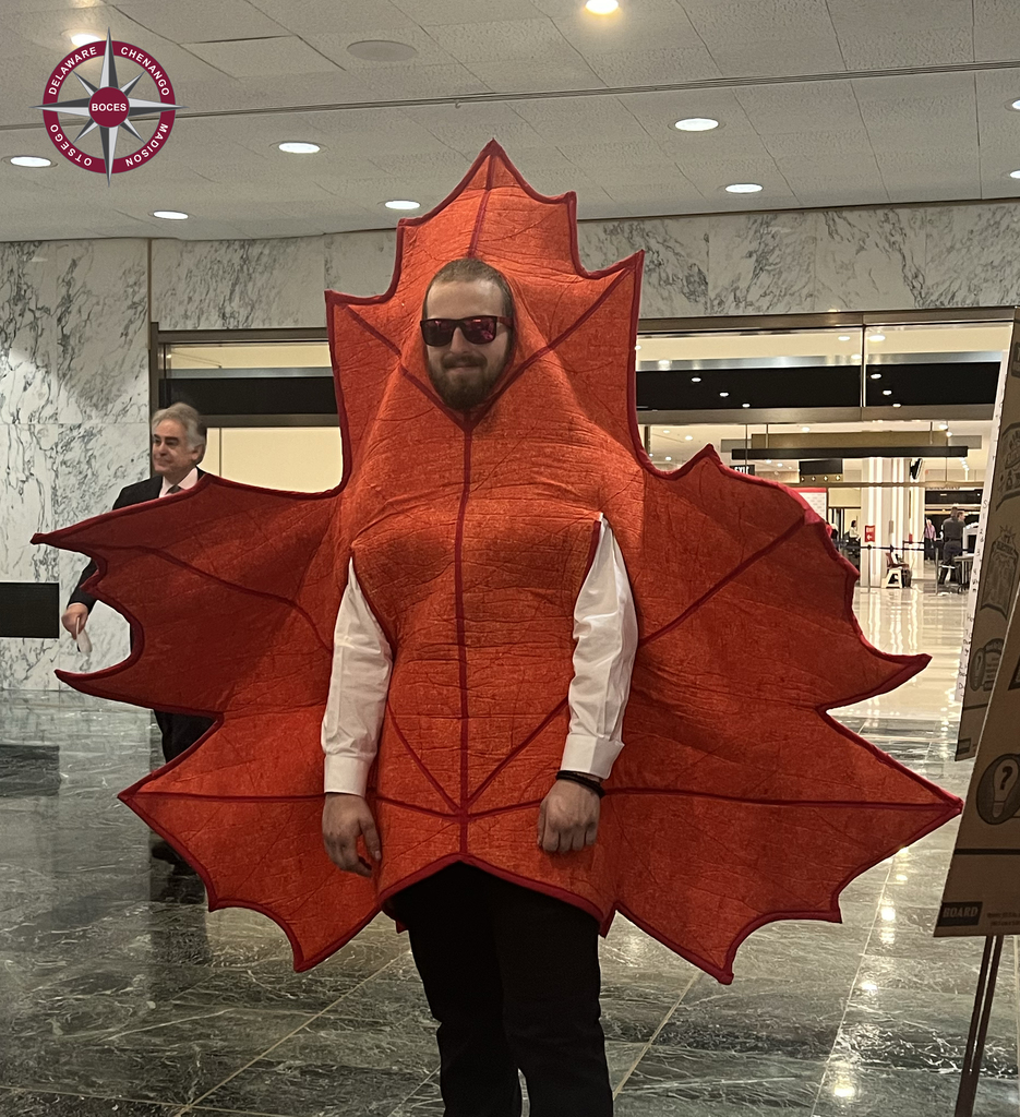 student in maple leaf costume