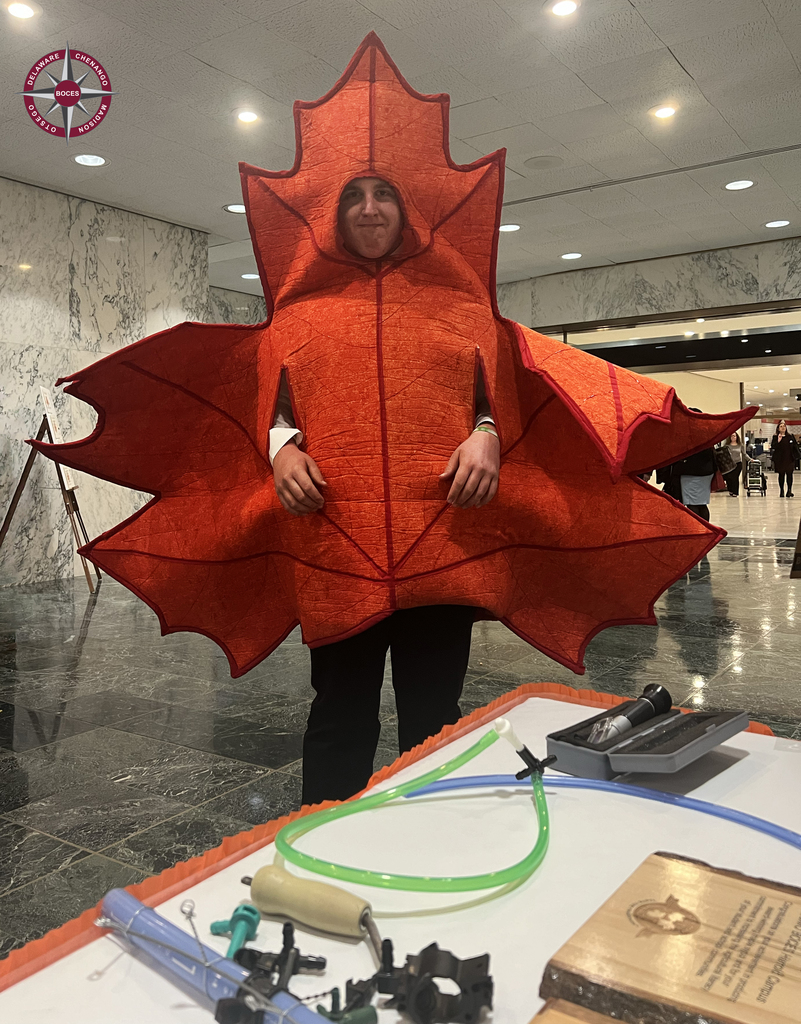 student in maple leaf costume