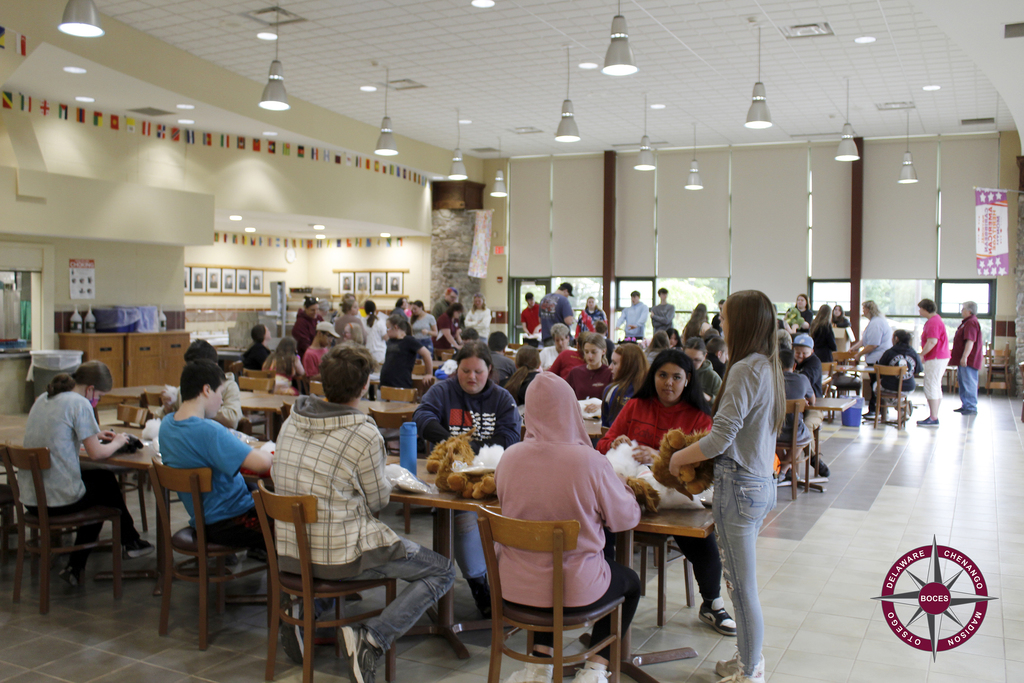 cafeteria full of students and staff fluffing bears