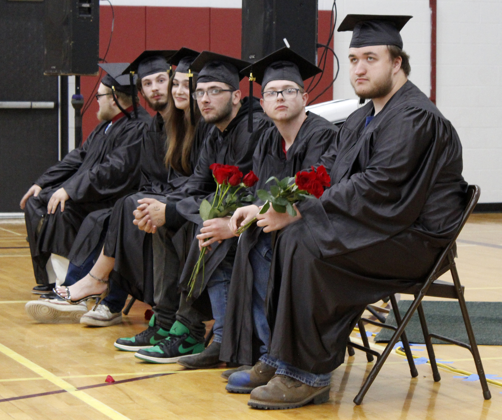 7 graduates sitting