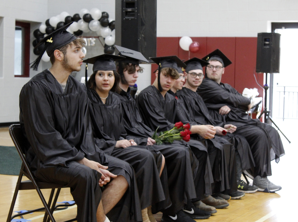 7 graduates sitting