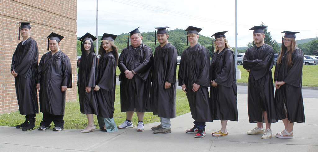 10 students in caps and gowns
