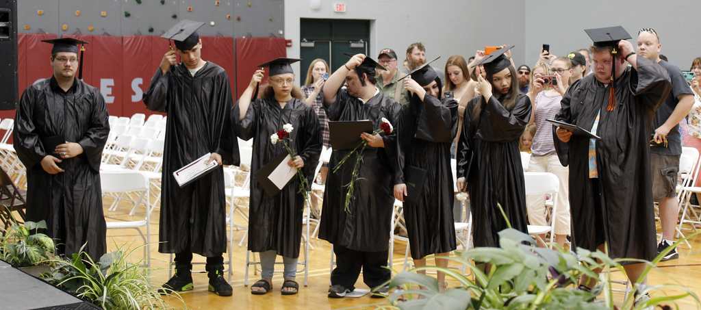 7 students moving tassle on cap