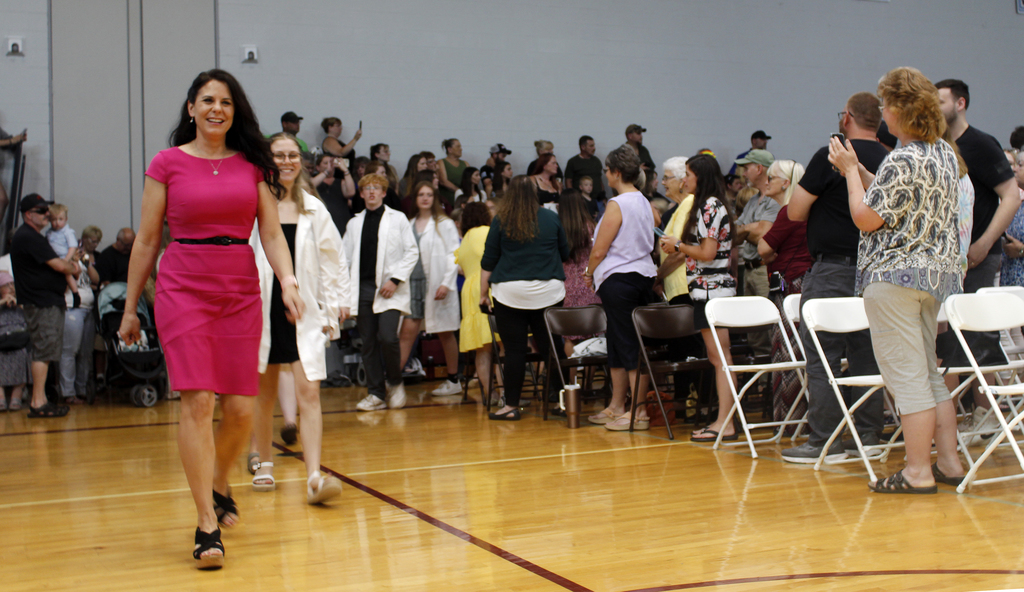 teacher leading her students in processional
