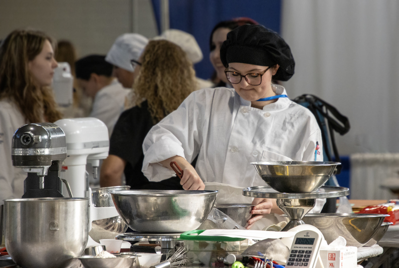 student competing in baking competition
