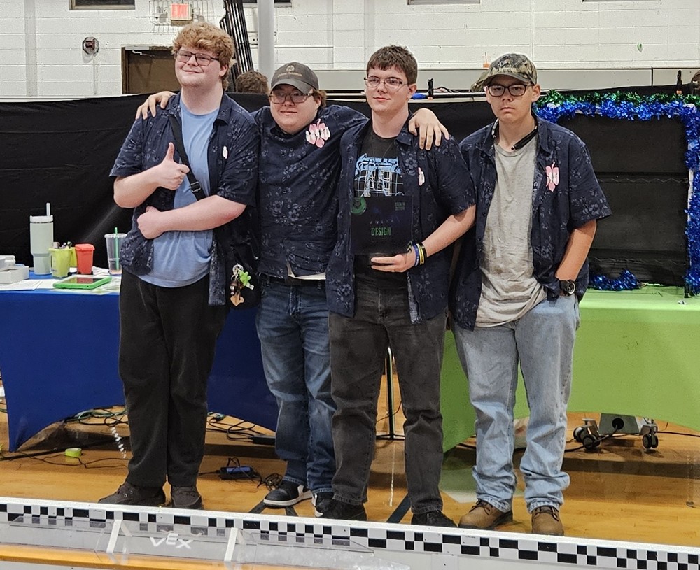 (left to right) Toby Young, Michael Ivy, Hunter Scarborough, and Logan Patty of Team 8892A "The Vidreams Redux" win the Design Award.