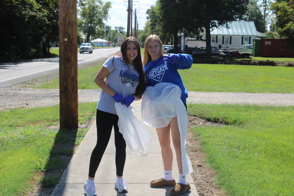 Girls Picking Up Trash