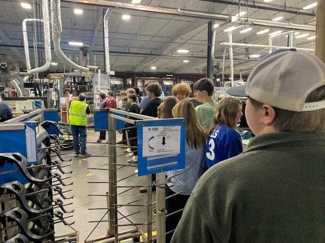 Students learning about robots and manufacturing