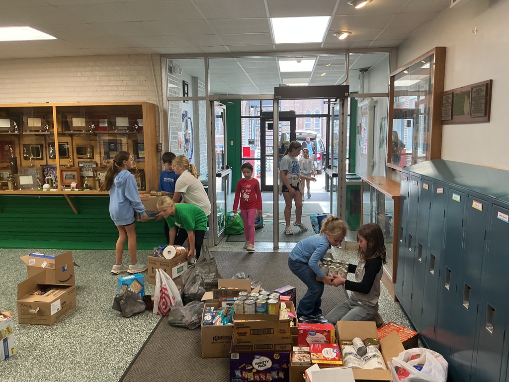students carrying boxes of food