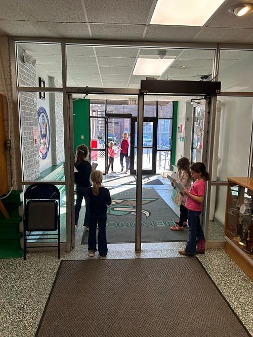 Student Leaders greeting guests for Veterans Day Program