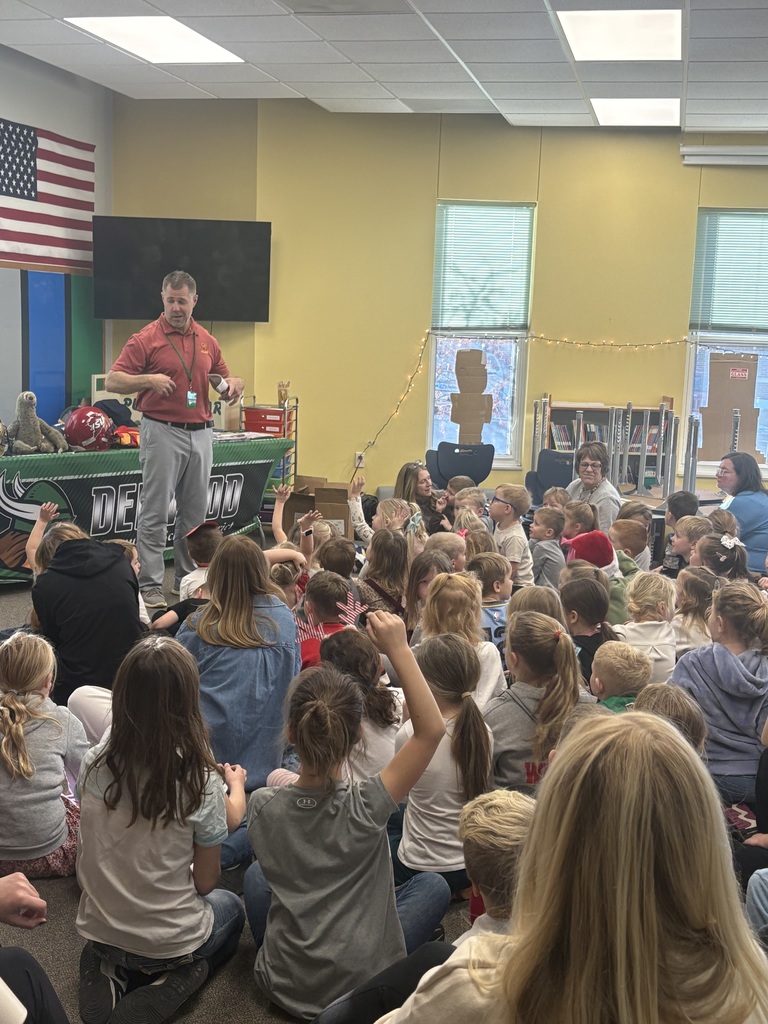Coach Sloth talking to older elementary students