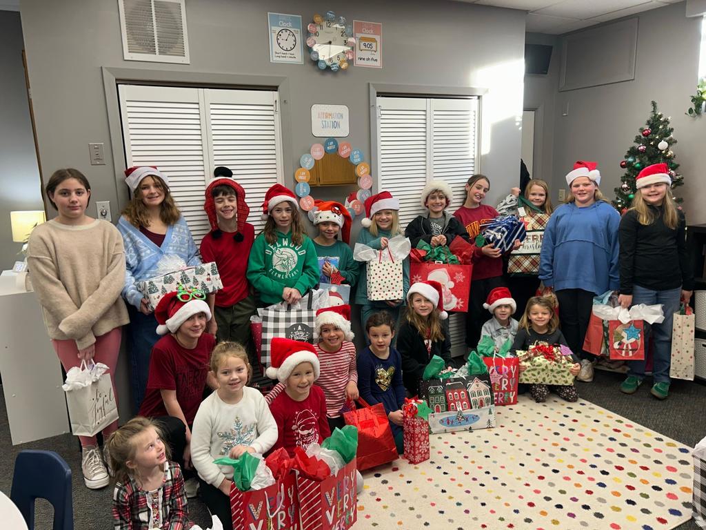 Student leaders posing with gifts