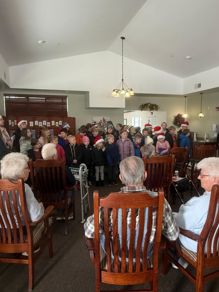 Students caroling at nursing homes in Maquoketa