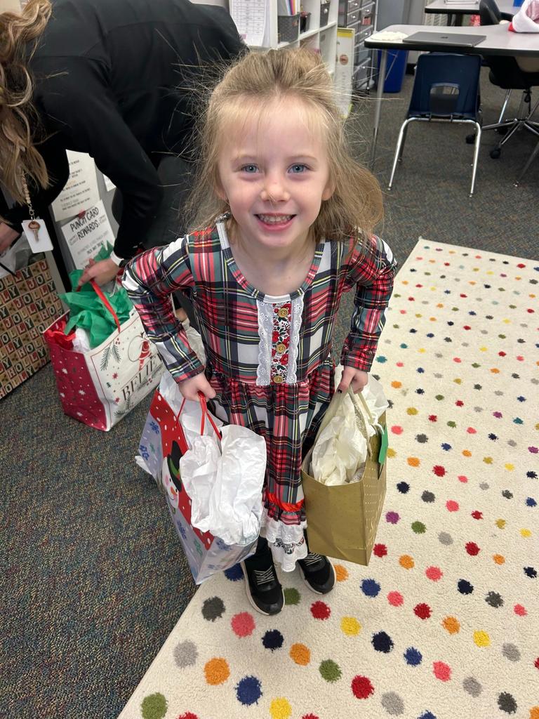 Student leaders carrying gifts for nursing home residents