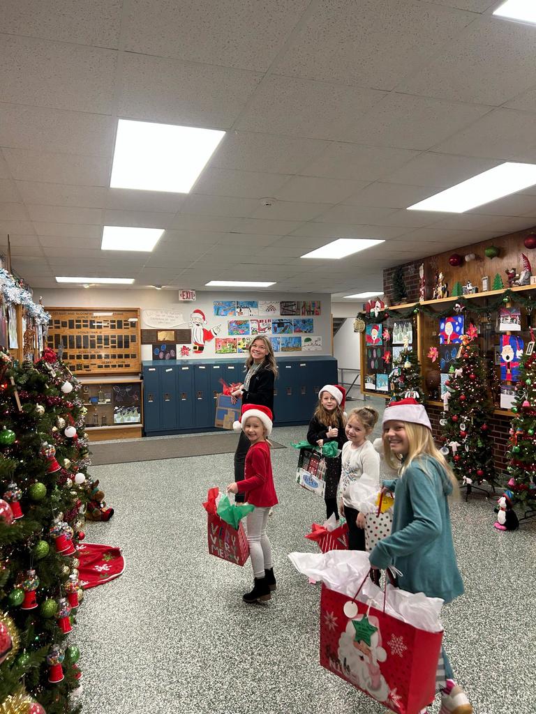 Student leaders carrying gifts for nursing home residents