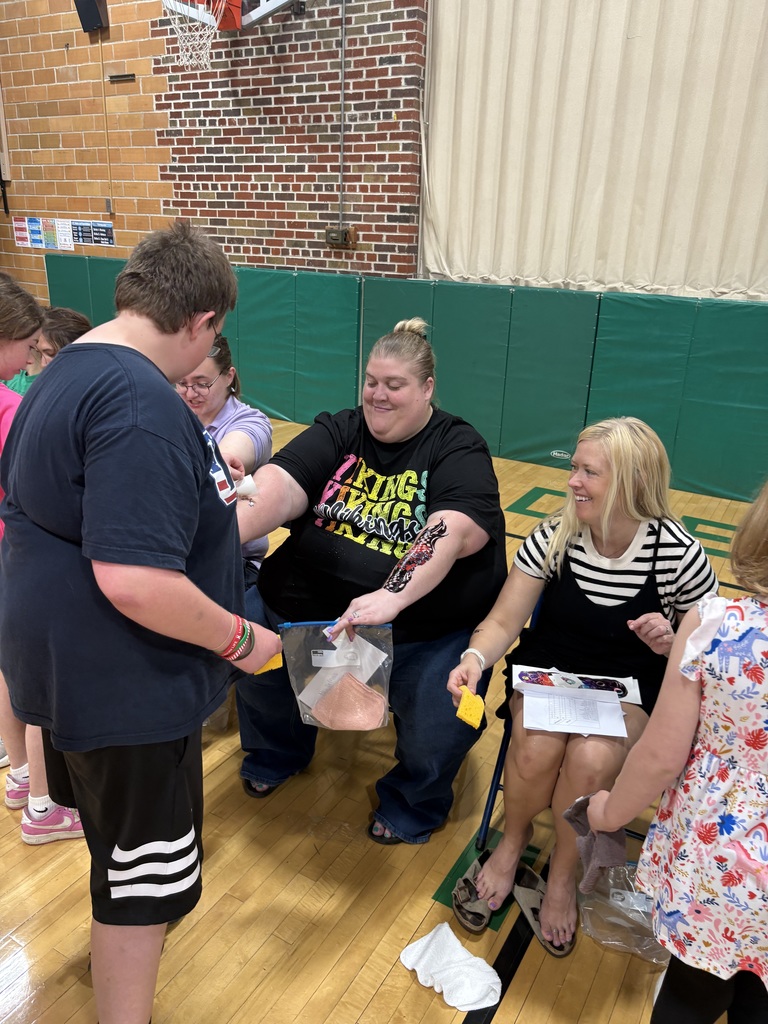 Mrs. DeMoss getting tattooed by Andrew Yarolem