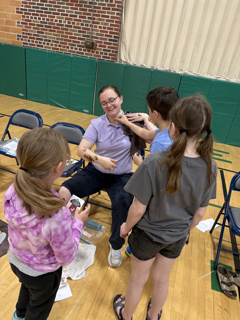 Ms. Spencer being tattooed by Rhett Morris