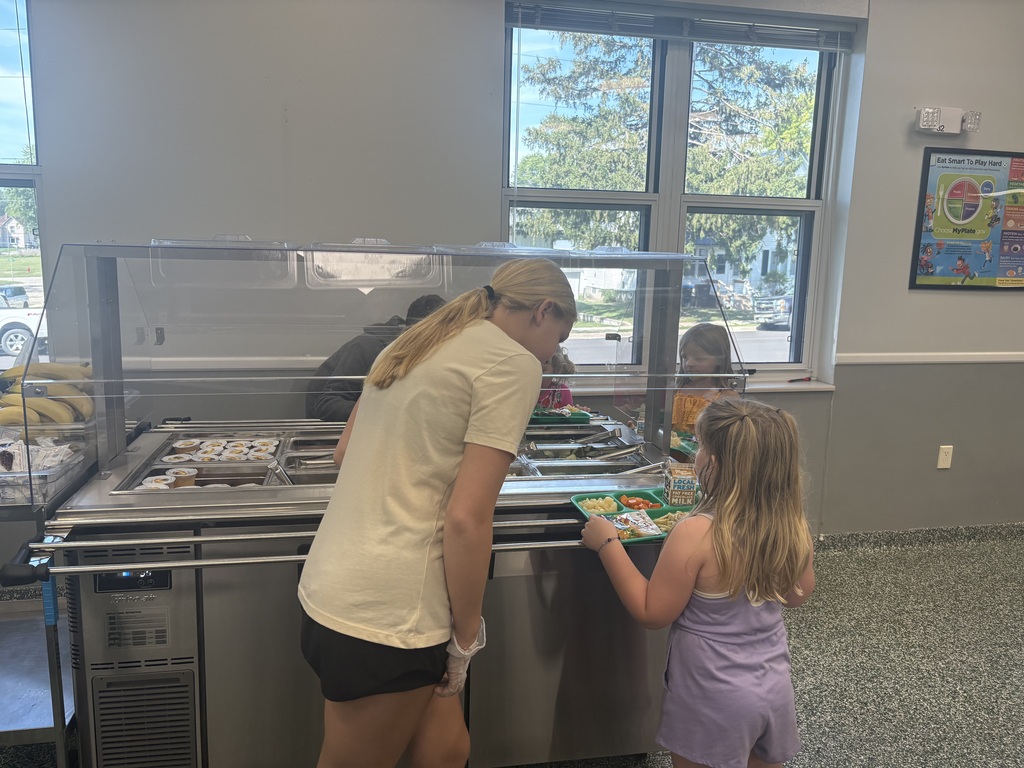 6th grade helping KG at the salad bar