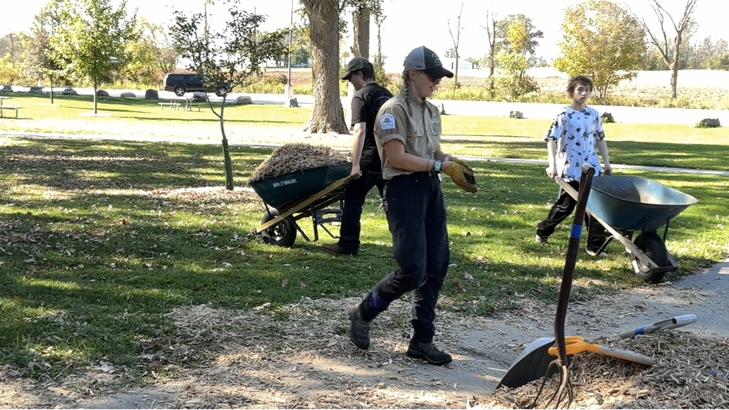 Speading mulch at Neshota Park.