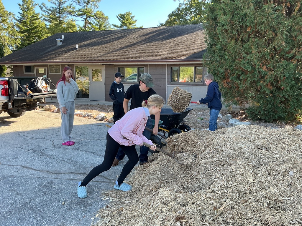Spreading mulch at Neshota Park.