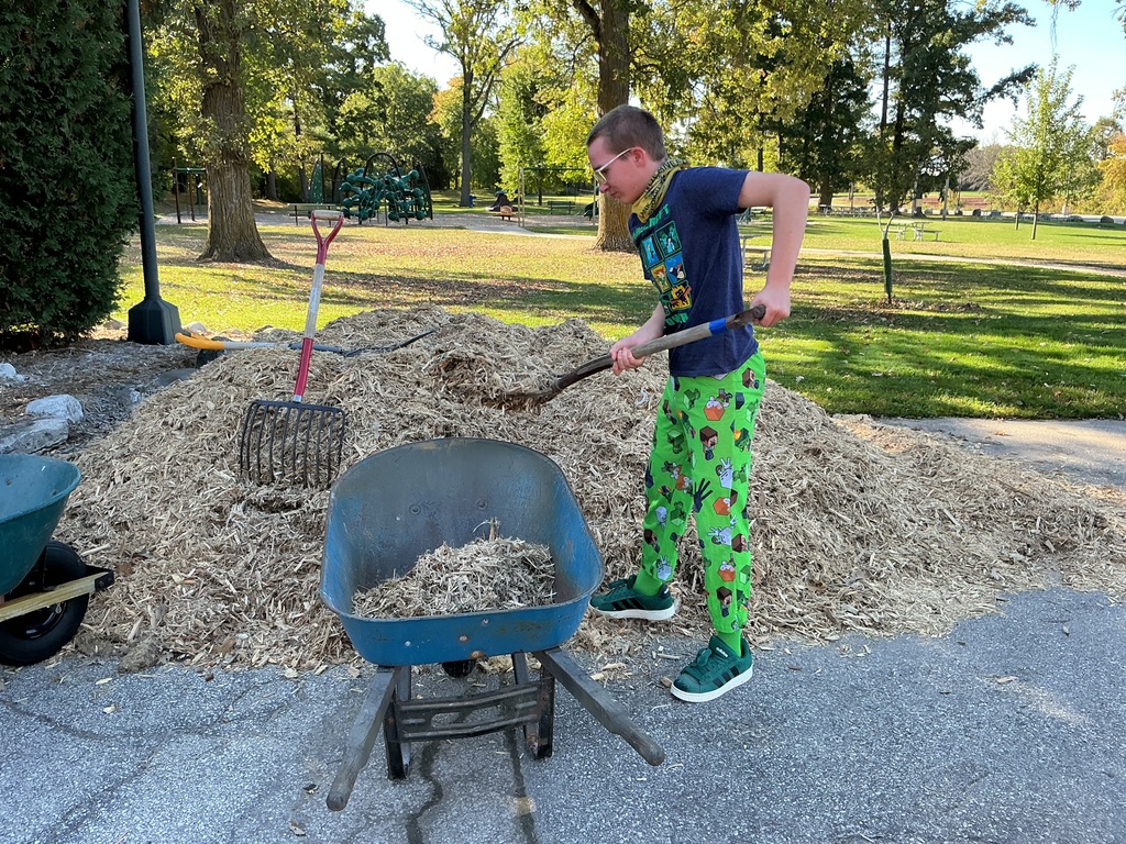 Spreading mulch.