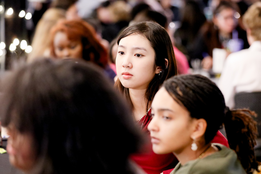 student listening at a table