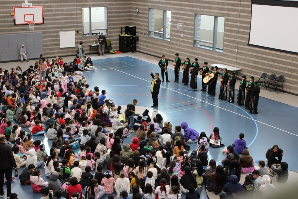 Mariachi band performing at school assembly