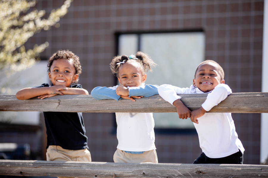 children standing by fence