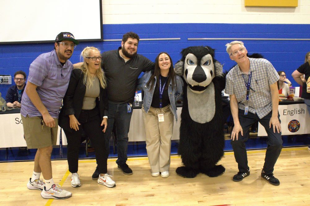 NEC staff posing with Wolfie