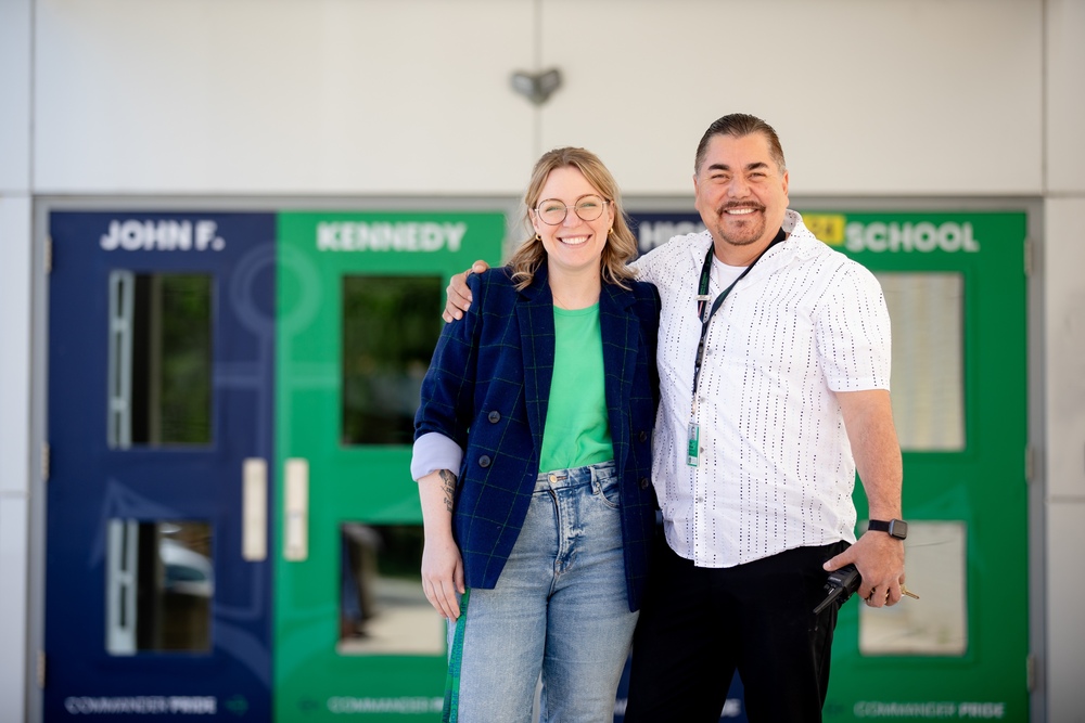 Alissa Jonesz and Antonio Reveles hugging smiling outside school entrance 
